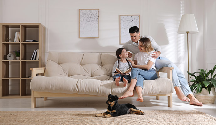 family with a happy pet in a room