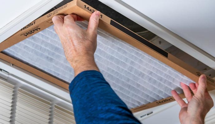 Person installing air filter