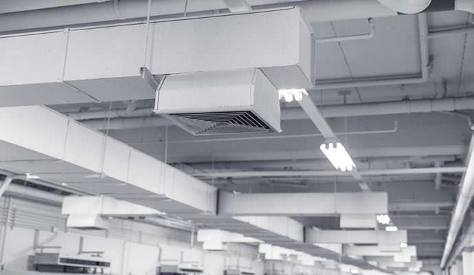 A large commercial space with visible many of air ducts